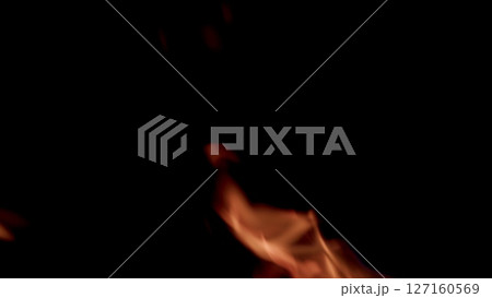 Dramatic and mesmerizing Flames along with Smoke on a rich Black Background that captivates 127160569