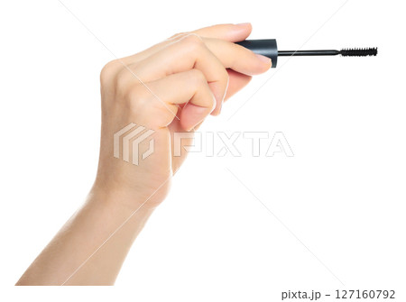 Woman hand holds cosmetic mascara brush, isolated on transparent background, cosmetics and visage concept Woman hand holds cosmetic mascara brush, isolated on transparent background, cosmetics and visage concept 127160792