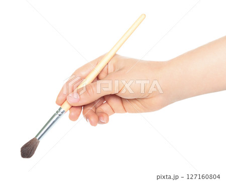 Woman hand holds paint brush, isolated on transparent background, painting and design concept 127160804
