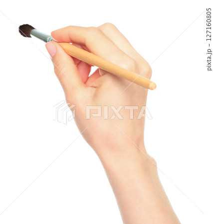 Woman hand holds paint brush, isolated on transparent background, painting and design concept 127160805