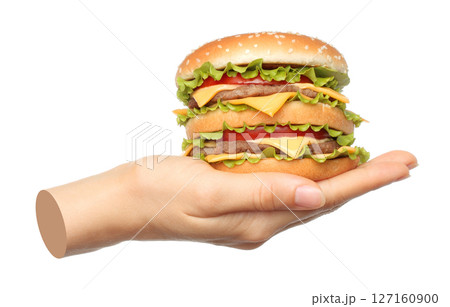 Hand holds big hamburger isolated on transparent background. Contemporary art Hand holds big hamburger isolated on transparent background. Contemporary art 127160900