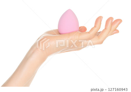 Woman Hand holds a cosmetic sponge, isolated on transparent background close-up, template for cosmetics ads Woman Hand holds a cosmetic sponge, isolated on transparent background close-up, template for cosmetics ads 127160943