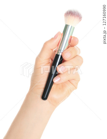 Woman hand holds black cosmetics brush, isolated on transparent background, cosmetics and visage concept 127160990