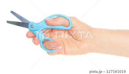 Woman hand holds Office Scissors, isolated on transparent background, stationery concept 127161019