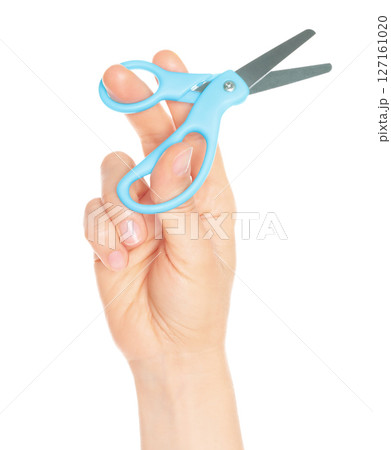 Woman hand holds Office Scissors, isolated on transparent background, stationery concept Woman hand holds Office Scissors, isolated on transparent background, stationery concept 127161020