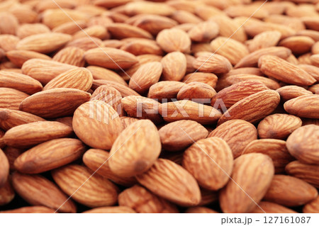 Background of Almonds nuts close-up, natural and healthy food concept for backgrounds and backdrops 127161087