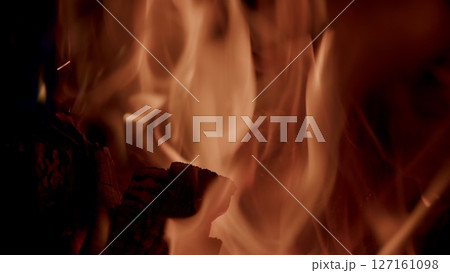 The Captivating and Luminous Flames Are Enticingly Dancing Gracefully in the Dark Night 127161098