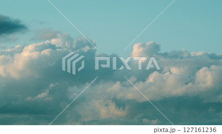 A Beautiful and Dramatic Cloudy Sky Over the Serene Landscape of Serenity and Calmness 127161236