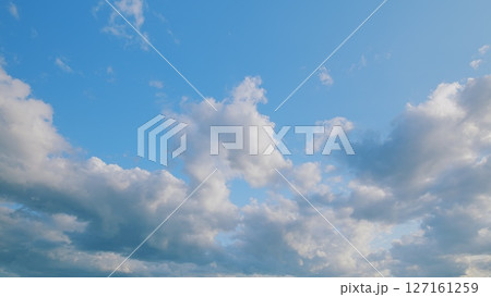 A Beautiful Sky filled with Fluffy Clouds against a Bright Blue Background, absolutely stunning A Beautiful Sky filled with Fluffy Clouds against a Bright Blue Background, absolutely stunning 127161259