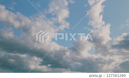 A Beautiful and Serene Cloudscape Set Against a Bright and Clear Blue Sky, Perfectly Calm A Beautiful and Serene Cloudscape Set Against a Bright and Clear Blue Sky, Perfectly Calm 127161260