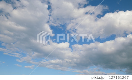 A Beautiful Cloudy Sky with a Stunning Blue Background that captivates the observers gaze A Beautiful Cloudy Sky with a Stunning Blue Background that captivates the observers gaze 127161267