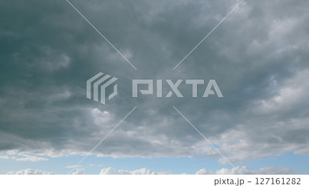 This image captures a Dramatic Cloudy Sky with Beautiful Blue Highlights in vivid detail 127161282