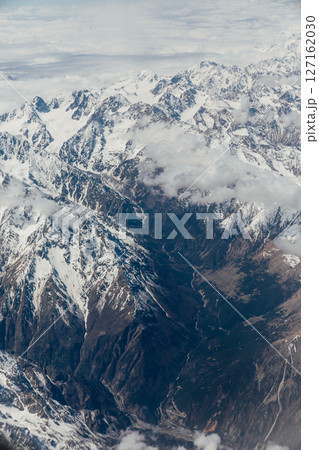 Landscape on the tops of the mountains of the Caucasus from an airplane elluminator 127162030