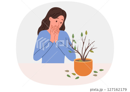 Dried out houseplant in pot causes stress to upset woman who is interested in botany 127162179