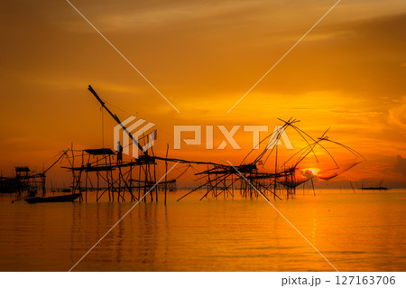 silhouette fishing boats on sunset silhouette fishing boats on sunset 127163706