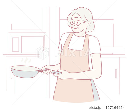 An elderly woman engaging in the delightful activity of cooking in her kitchen using a frying pan An elderly woman engaging in the delightful activity of cooking in her kitchen using a frying pan 127164424