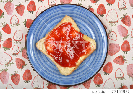 Toast with red strawberry jam 127164977