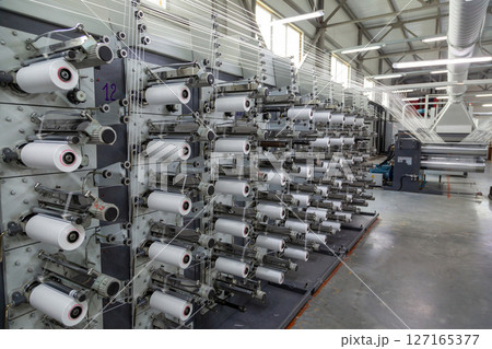 A range of equipment with spools of polypropylene threads. A range of equipment with spools of polypropylene threads. 127165377