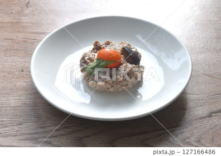 steamed chop pork topping salty egg yolk with black mushroom in gravy sauce on plate steamed chop pork topping salty egg yolk with black mushroom in gravy sauce on plate 127166486