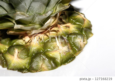 Close up of pieapple fruit skin on white background 127168219