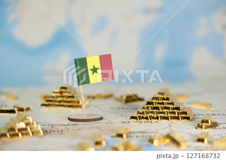 Senegal flag and gold bars on a world map symbolize national economy, resource wealth, global investment opportunities, and financial market growth Senegal flag and gold bars on a world map symbolize national economy, resource wealth, global investment opportunities, and financial market growth 127168732