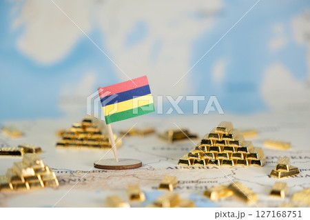 Mauritius flag stands among shiny gold bars on a global map, symbolizing national wealth, international investment, and economic strategy with open copy space Mauritius flag stands among shiny gold bars on a global map, symbolizing national wealth, international investment, and economic strategy with open copy space 127168751