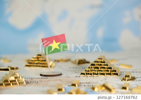 Burkina Faso flag and abundant gleaming gold bars on a world map, symbolizing national wealth, resource potential, and global economy with copy space Burkina Faso flag and abundant gleaming gold bars on a world map, symbolizing national wealth, resource potential, and global economy with copy space 127168762