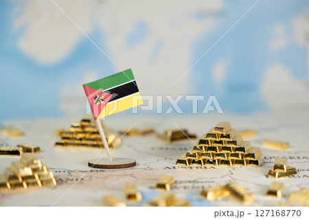Mozambique flag on a world map with stacked gold bars, symbolizing national wealth, global resource investment, and economic growth potential, offering ample copy space 127168770