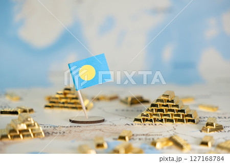 Palau flag proudly standing amidst shining gold bars on a world map, symbolizing national economic prosperity, international finance, and strategic global investment, with clear copy space Palau flag proudly standing amidst shining gold bars on a world map, symbolizing national economic prosperity, international finance, and strategic global investment, with clear copy space 127168784