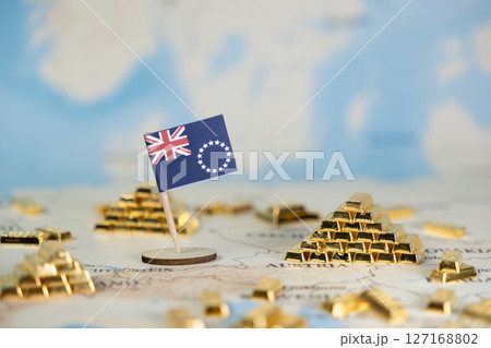 Cook Islands flag, glittering gold bars on world map, symbolizing national wealth, global investment, economic development, and financial stability 127168802