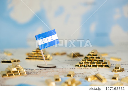 Honduras flag and gold bars on a world map, symbolizing national economic wealth, financial stability, and global investment potential, with ample copy space Honduras flag and gold bars on a world map, symbolizing national economic wealth, financial stability, and global investment potential, with ample copy space 127168881