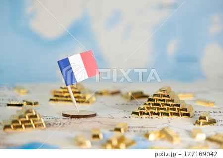 French flag with scattered gold bars on a European map, depicting national wealth, economic prosperity, and global investment, offering ample clear copy space French flag with scattered gold bars on a European map, depicting national wealth, economic prosperity, and global investment, offering ample clear copy space 127169042