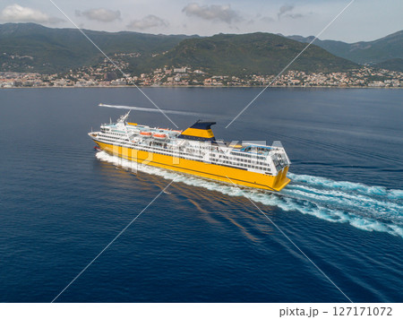Big yellow passenger ferry goes on the Mediterranean Sea near Corsica island, France aerial view Cityscape Bastia port Big yellow passenger ferry goes on the Mediterranean Sea near Corsica island, France aerial view Cityscape Bastia port 127171072