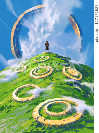 Traveler Stands on Hilltop Surrounded by Mysterious Stone Rings Under Giant Sky Portal 127171625