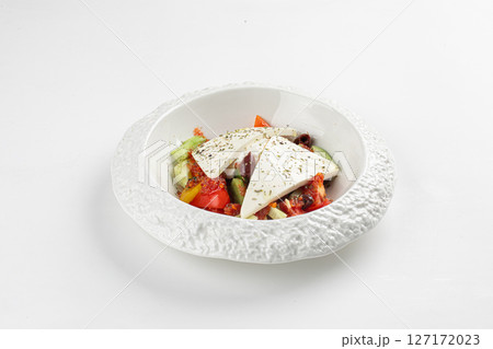 Portion of greek salad with vegetables 127172023
