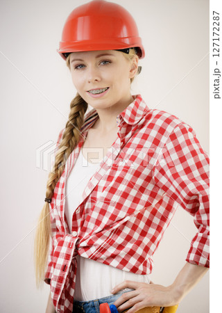 Teenage woman being construction worker 127172287