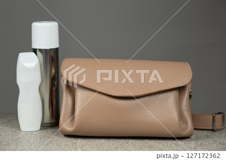 Cleaning a Leather Handbag. Leather Purse Maintenance. Proper Cleaning Tips. 127172362