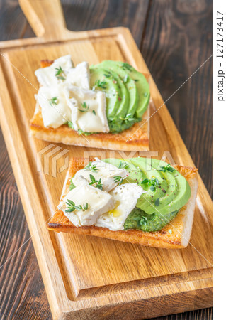Ciabatta Sandwiches With Brie, Avocado, Creamy Spinach And Fresh Thyme Garnish 127173417