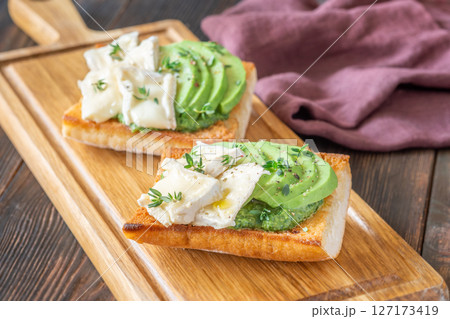 Ciabatta Sandwiches With Brie, Avocado, Creamy Spinach And Fresh Thyme Garnish Ciabatta Sandwiches With Brie, Avocado, Creamy Spinach And Fresh Thyme Garnish 127173419
