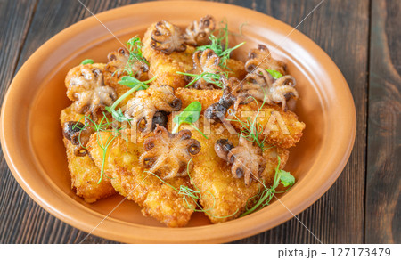 Golden Potato Rosti With Baby Octopuses And Fresh Pea Shoots Garnished Delicately Golden Potato Rosti With Baby Octopuses And Fresh Pea Shoots Garnished Delicately 127173479