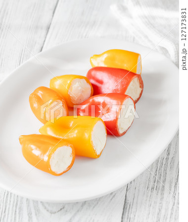 Colorful Baby Bell Peppers Stuffed With Cream Cheese on White Plate Colorful Baby Bell Peppers Stuffed With Cream Cheese on White Plate 127173831