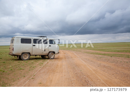 Off-road vehicles in remote region of Mongolia. Gobi desert area Off-road vehicles in remote region of Mongolia. Gobi desert area 127173979