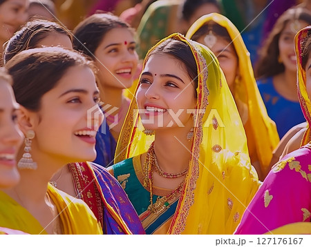 Radiant Woman in Yellow Saree Among Smiling Festive Crowd 127176167