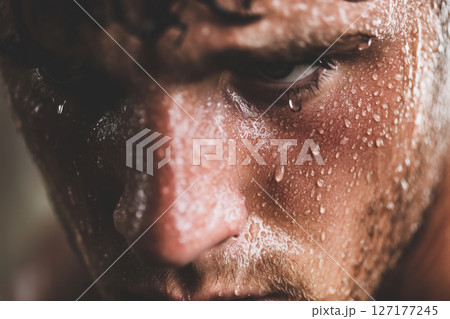 A dramatic portrait captures a man's tears and emotions showcasing vulnerability and depth. 127177245