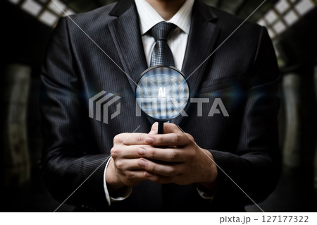 Pro in suit examines AI symbol with magnifier. 127177322