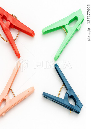Colorful Plastic Clothespins on White Background for Laundry or Household Use 127177906