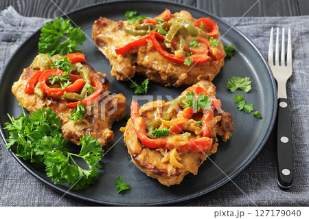 pork chops topped with bell pepper cream gravy pork chops topped with bell pepper cream gravy 127179040