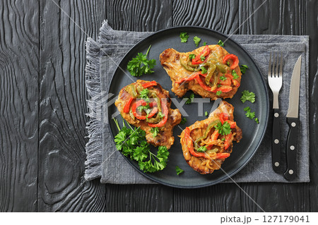 pork chops topped with bell pepper cream gravy pork chops topped with bell pepper cream gravy 127179041