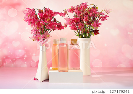 Spa salon advertising card, Wellness composition with rose water and fresh columbine and aquilegia flowers, natural self-care and healthy lifestyle concept, abstract composition with flowers. Spa salon advertising card, Wellness composition with rose water and fresh columbine and aquilegia flowers, natural self-care and healthy lifestyle concept, abstract composition with flowers. 127179241