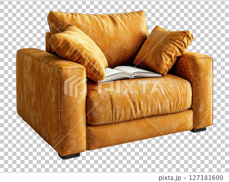 Cozy orange armchair with plush cushions and open book resting on it 127181600